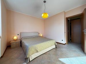 Postel nebo postele na pokoji v ubytování La casa di Emy- Larihome A74