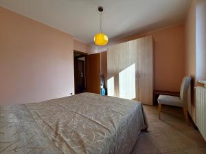 Postel nebo postele na pokoji v ubytování La casa di Emy- Larihome A74