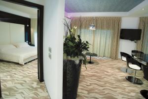 Телевизор и/или развлекательный центр в Hotel Premier & Suites - Premier Resort