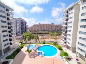 a view of the pool from the balcony of a apartment at ACV- Terrazas II-2ª linea planta 9 este in El Borseral