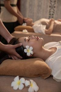 a woman getting a massage at a spa at Lynnaya Urban River Resort in Siem Reap