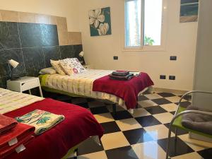 Ein Bett oder Betten in einem Zimmer der Unterkunft NATURAL CONFITAL BEACH