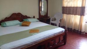 Кровать или кровати в номере Haranya Homestay
