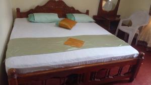 Кровать или кровати в номере Haranya Homestay