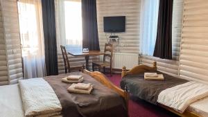 Postel nebo postele na pokoji v ubytování Villa Morishka & SPA