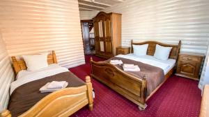 Postel nebo postele na pokoji v ubytování Villa Morishka & SPA