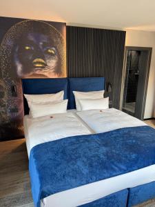 Postel nebo postele na pokoji v ubytování REINHARDTs HOTEL