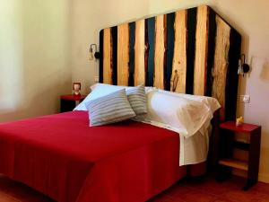 Postel nebo postele na pokoji v ubytování Agriturismo Violati