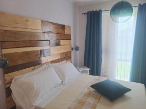 Postel nebo postele na pokoji v ubytování Agriturismo Violati