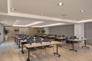 a conference room with tables and chairs in it at INNSiDE by Meliá Palma Bosque in Palma de Mallorca +136 photos