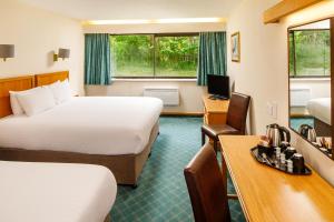 Letto o letti in una camera di Mercure Livingston Hotel