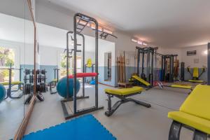 a gym with a bunch of equipment in it at Hurricane Beach Hotel in Tarifa