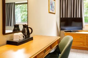 TV o dispositivi per l'intrattenimento presso Mercure Livingston Hotel