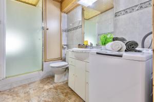 a bathroom with a toilet and a sink and a shower at Mediterranean Way - Promar 248 in La Pineda +14 photos