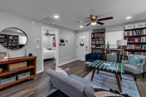 a living room with a couch and bookshelves at Charming Pet Friendly Concord Retreat home in Concord