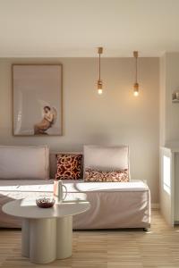 a living room with a bed and a table at RentPlanet - Apartamenty Rynek in Wrocław