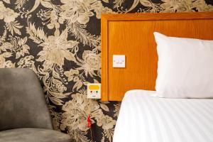 Letto o letti in una camera di Mercure Livingston Hotel