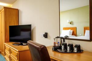 TV o dispositivi per l'intrattenimento presso Mercure Livingston Hotel