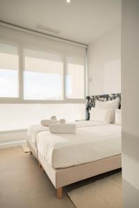 Pure Sea Apartments Villajoyosa客房内的一张或多张床位