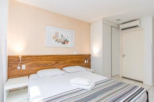 Giường trong phòng chung tại Vision Hotel em Brasília 85145