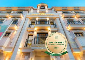 a tall building with a top best fine star city hotels at Residence City Garden - Certificate of Excellence Top 10 BEST Five-Stars City Hotels for 2024 awarded by HTIF in Plovdiv