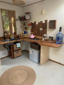 a kitchen with a counter top and a sink at Cabaña entre parras in Curacaví