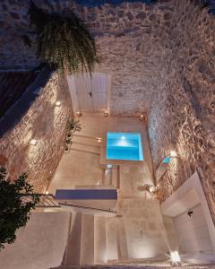 a view of a building with a swimming pool at Orange Tree House in Vis