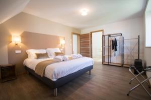 Postel nebo postele na pokoji v ubytování Grande maison de vacances L'Orée des Vignes