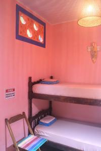 Ubatuba Wild Surf Hostel客房内的一张或多张床位