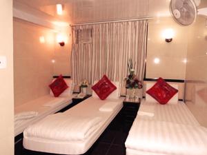 Voodi või voodid majutusasutuse Manila Hotel -Hostel Block D toas