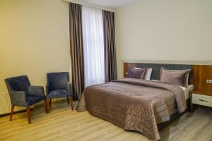 Postel nebo postele na pokoji v ubytování Zengezur Harmony Wellness Resort