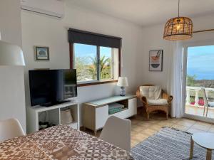 TV a/nebo společenská místnost v ubytování Casa Caro, Las Norias
