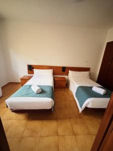 Postel nebo postele na pokoji v ubytování Hostal Legaz