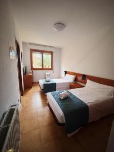 Postel nebo postele na pokoji v ubytování Hostal Legaz