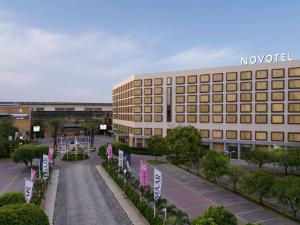 a large building with a street in front of it at Novotel Hyderabad Convention Centre in Hyderabad