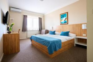 Posteľ alebo postele v izbe v ubytovaní Hotel Phoenix