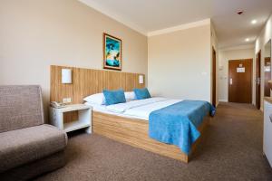 Posteľ alebo postele v izbe v ubytovaní Hotel Phoenix