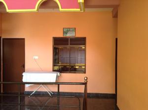 a hospital room with a bed and a window at Sunshine Hotel in Trincomalee
