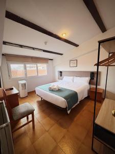 Postel nebo postele na pokoji v ubytování Hostal Legaz + 37 fotografií