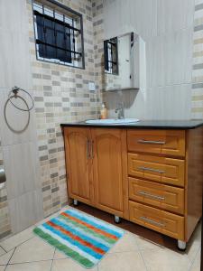 a bathroom with a sink and a mirror at Blue Star Villa in Pointe d'Esny +27 photos