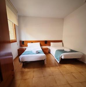Postel nebo postele na pokoji v ubytování Hostal Legaz