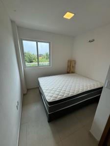 Katil atau katil-katil dalam bilik di Condominio Jardim Dos Coqueiros 3 Andar