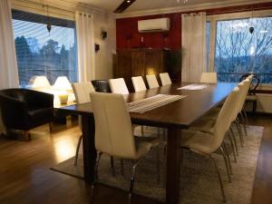 a dining room with a table and chairs at Holiday Home Villa meka by Interhome in Sastamala