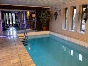 a swimming pool in a house at Holiday Home Villa meka by Interhome in Sastamala