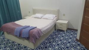 Postel nebo postele na pokoji v ubytování Ekm Hotel