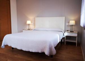 Postel nebo postele na pokoji v ubytování Apartamentos Ronda Luz