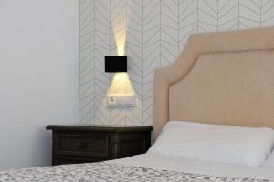 Postel nebo postele na pokoji v ubytování Apartamentos Ronda Luz
