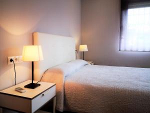 Postel nebo postele na pokoji v ubytování Apartamentos Ronda Luz