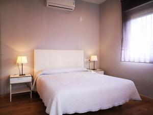 Postel nebo postele na pokoji v ubytování Apartamentos Ronda Luz