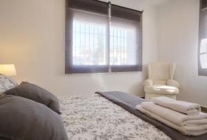 Postel nebo postele na pokoji v ubytování Apartamentos Ronda Luz